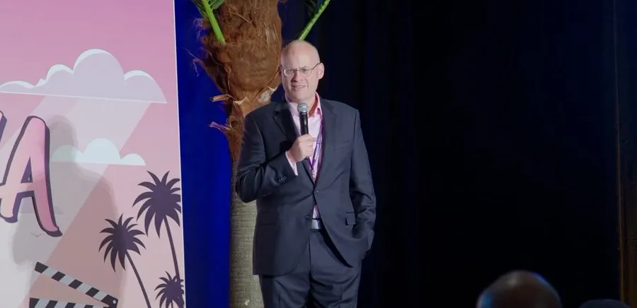 Ian McCullough speaking on stage at Knowlejcon 2026